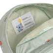 Innenfach des mintgrünen Kinderrucksacks mit integriertem Namensschild und praktischem Innenfach.